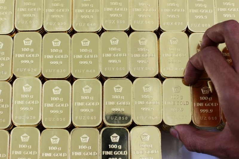 Gold prices hit 2-week high as weak PMIs dent dollar, yields